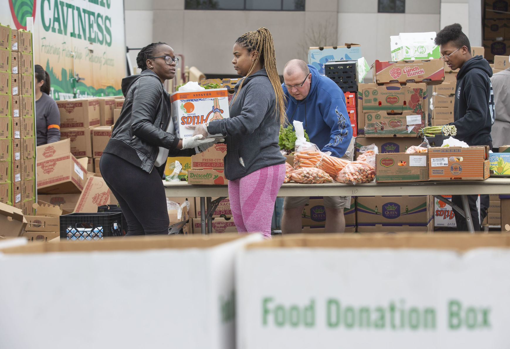 Crowds flock to produce giveaway at Daystar Church